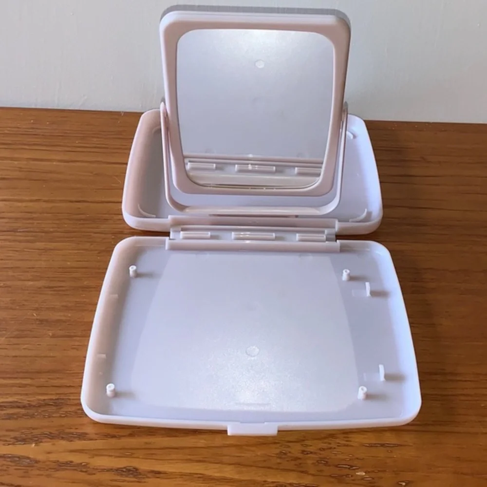Mary Kay pink plastic compact travel mirror.